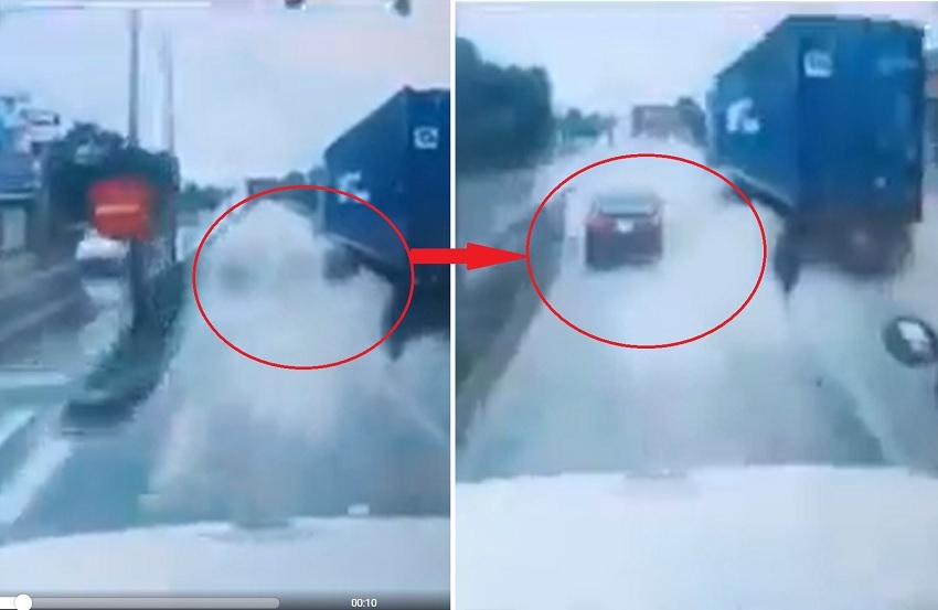 Clip thót tim: Ô tô con hút chết sau pha tạt té của xe container dưới trời mưa to