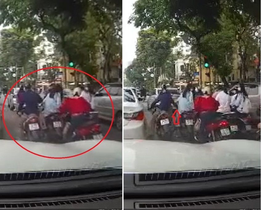 Giữa phố Hà Nội, 2 cô gái dừng đèn đỏ bị nhóm đối tượng dàn cảnh móc trộm điện thoại