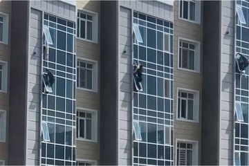 Thót tim nhìn người đàn ông đu bám ngoài cửa sổ tầng 7 để cứu bé gái