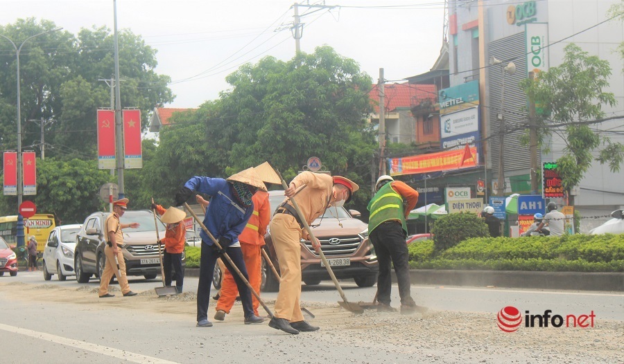 Cảnh sát giao thông,bê tông,vật liệu rơi vãi,quốc lộ 1A,Nghệ An,nguy hiểm,dọn đường