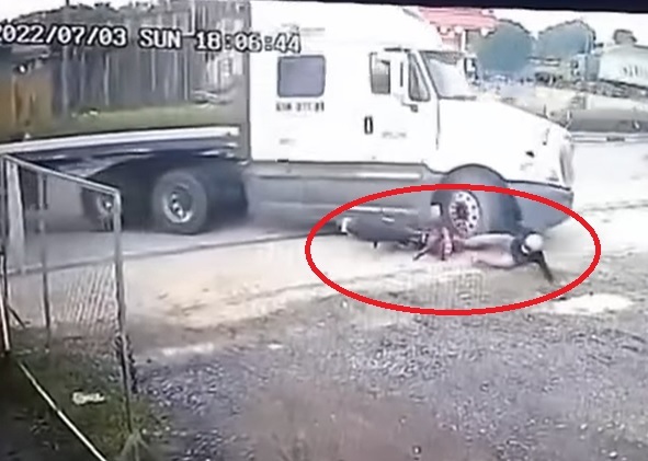 Nam thanh niên may mắn thoát nạn dưới bánh xe container